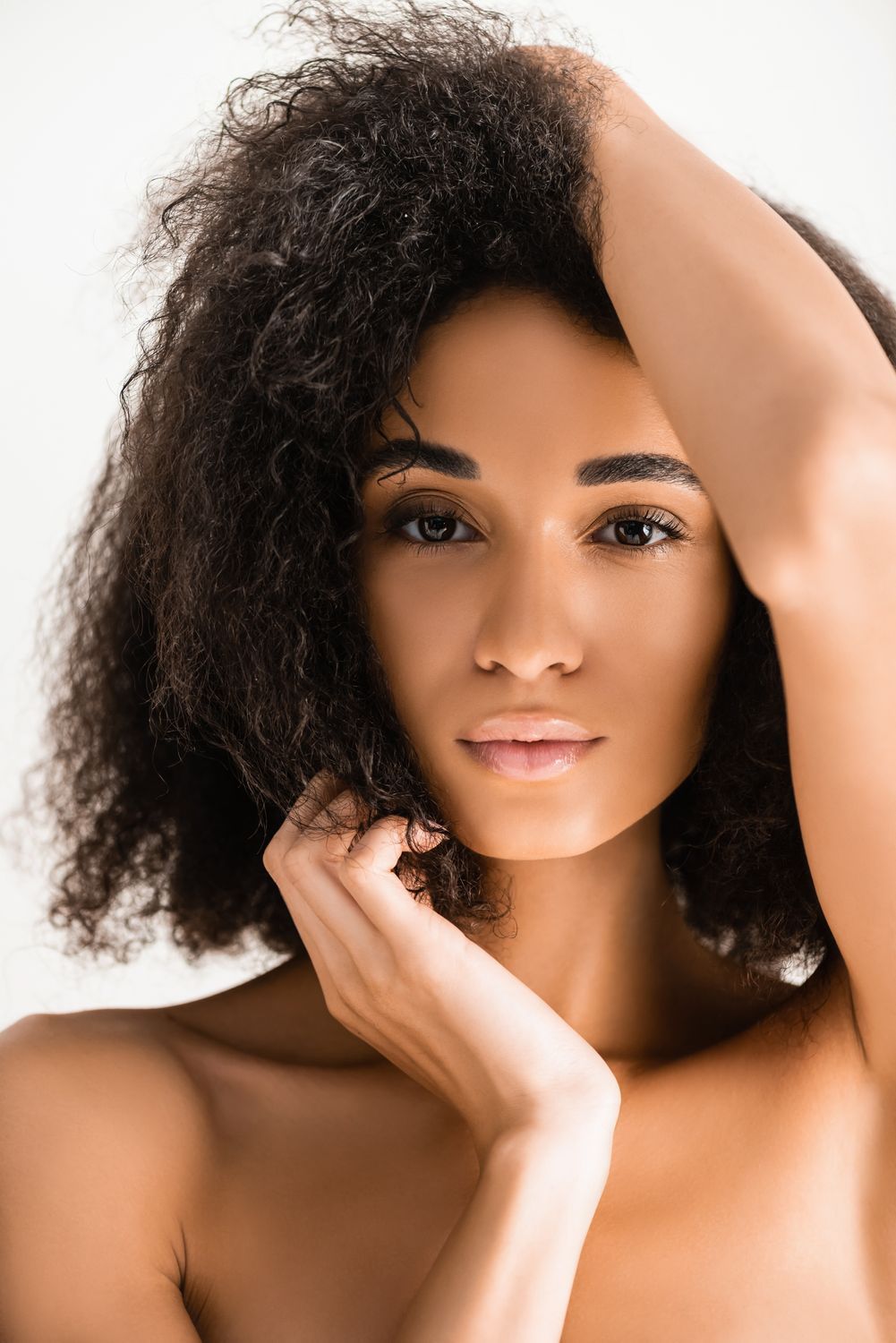 microneedling patient model with curly black hair