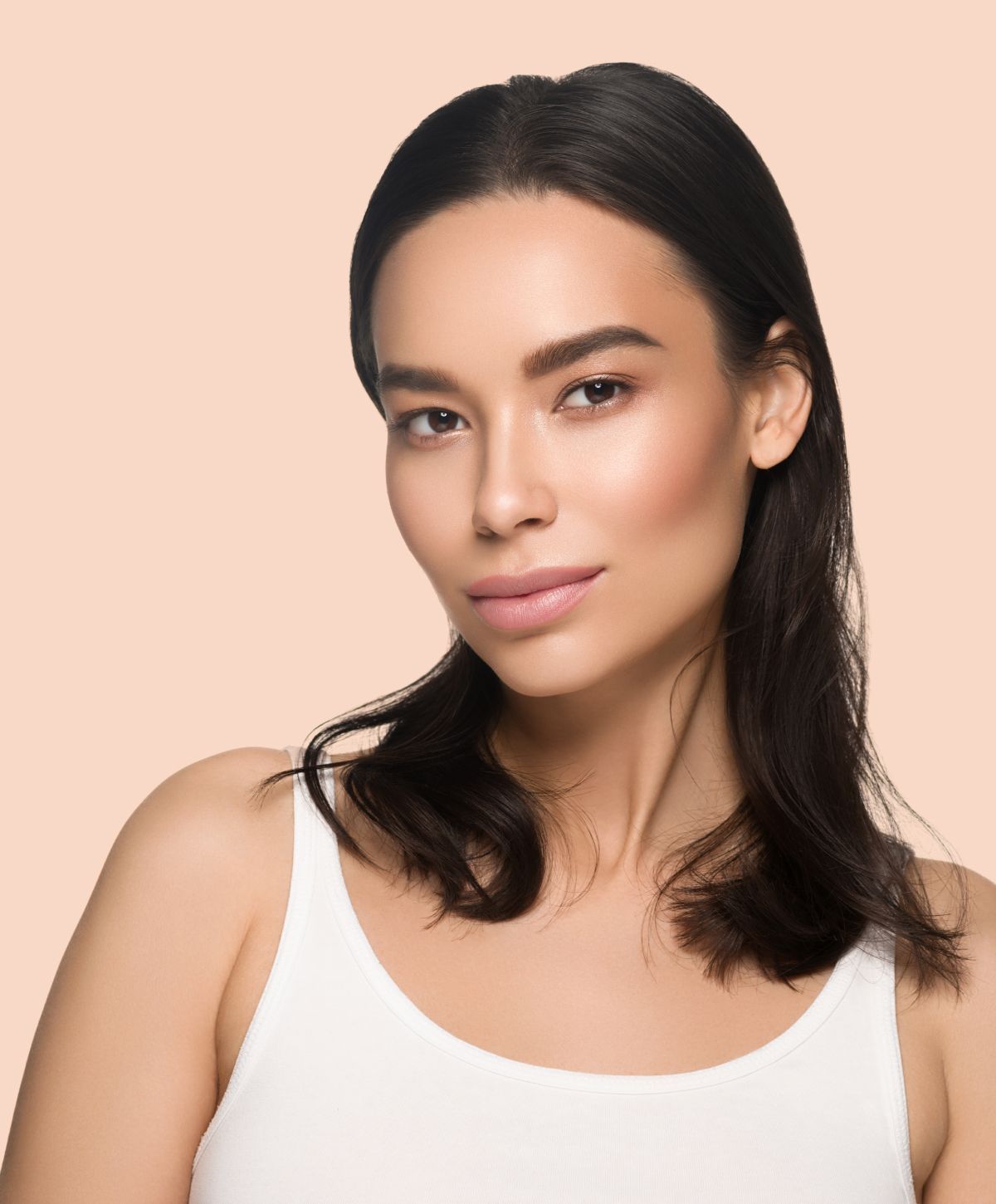 kybella patient model with dark hair wearing a white tanktop